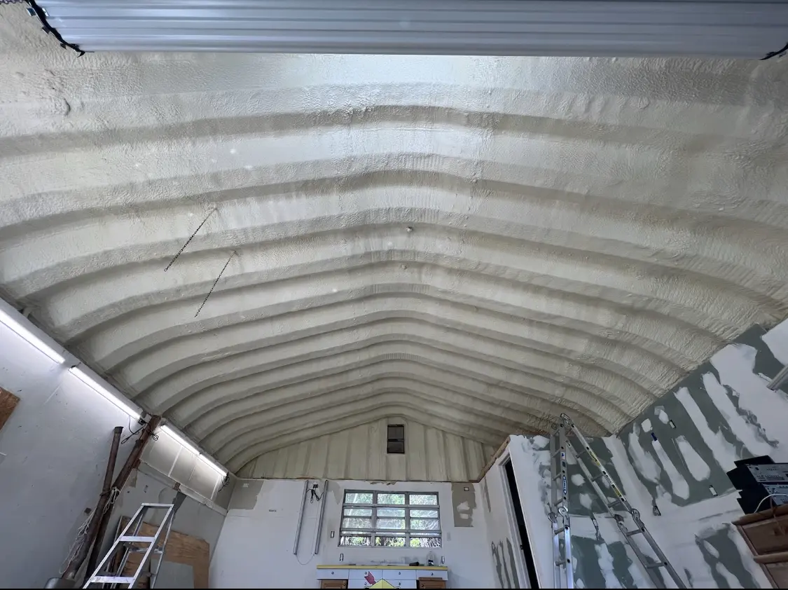 Spray polyurethane foam applied to the underside of a metal roof deck in Ione